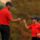 Tiger Woods of the United States and son Charlie Woods fist bump on the 18th hole during the final round of the PNC Championship at the Ritz Carlton Golf Club on December 20, 2020 in Orlando, Florida.